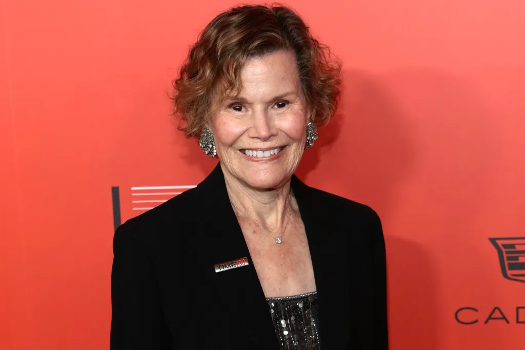 Judy Blume smiling with a Time 100 pin on her blazer.