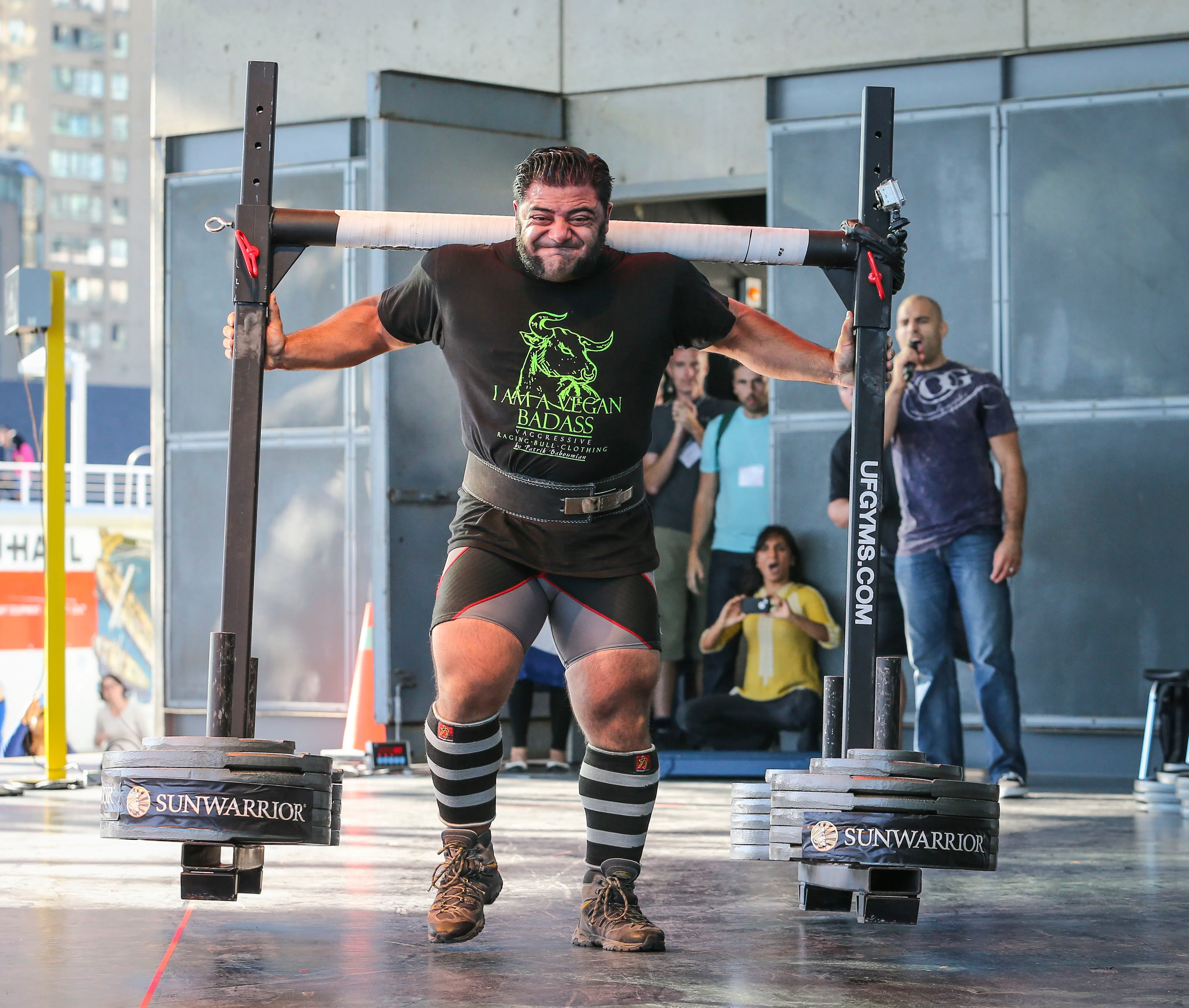 A man breaking the world record by carrying 555 kilos for 10 meters