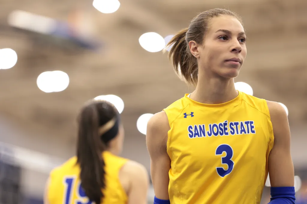 San Jose State volleyball player in a yellow and blue uniform.