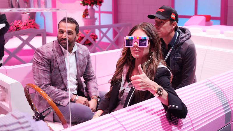 FBI director Kash Patel and Secretary of Homeland Security Kristi Noem sit in a pink Cadillac made of LEGO blocks before the Formula One Las Vegas Grand Prix auto race, on Nov. 22, 2025 in Las Vegas.
