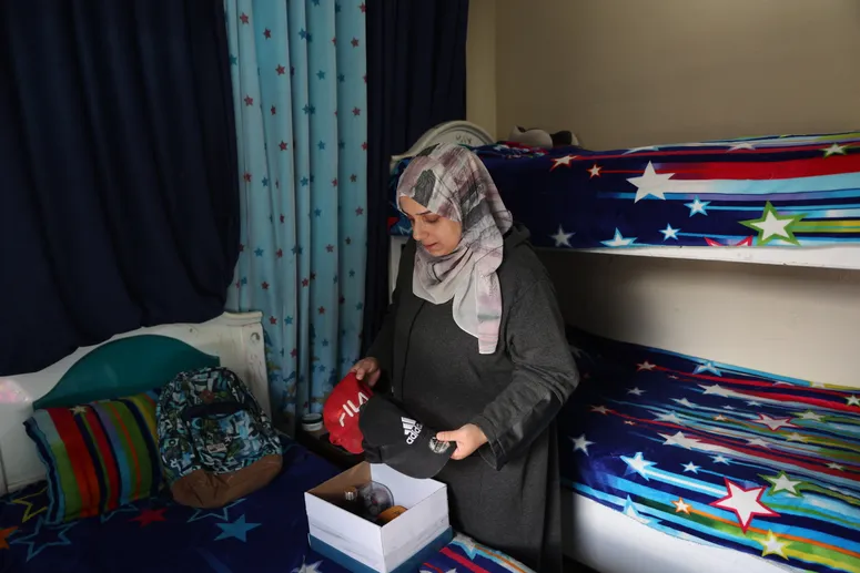 Image may contain: Apsana Begum, Adult, Person, Clothing, Scarf, Face, Head, Accessories, Bag, and Handbag