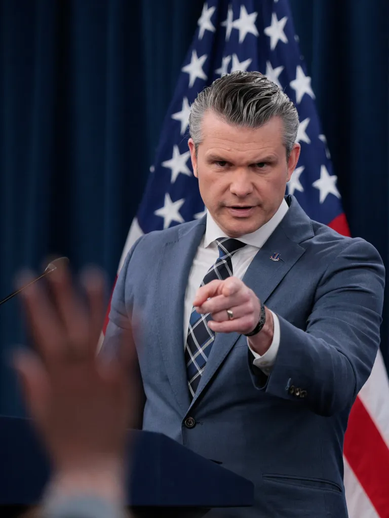 U.S. Secretary of Defense Pete Hegseth points at a briefing amid the U.S.-Israeli war on Iran.