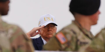 Trump’s wearing of baseball cap during dignified transfer draws criticism