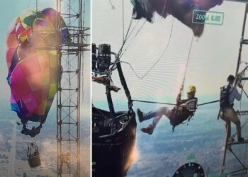 Trapped hot air balloon passengers saved in heart-stopping rescue at nearly 1,000 feet above ground