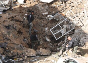 Israel and Iran exchange strikes as Trump says U.S. is negotiating end to war