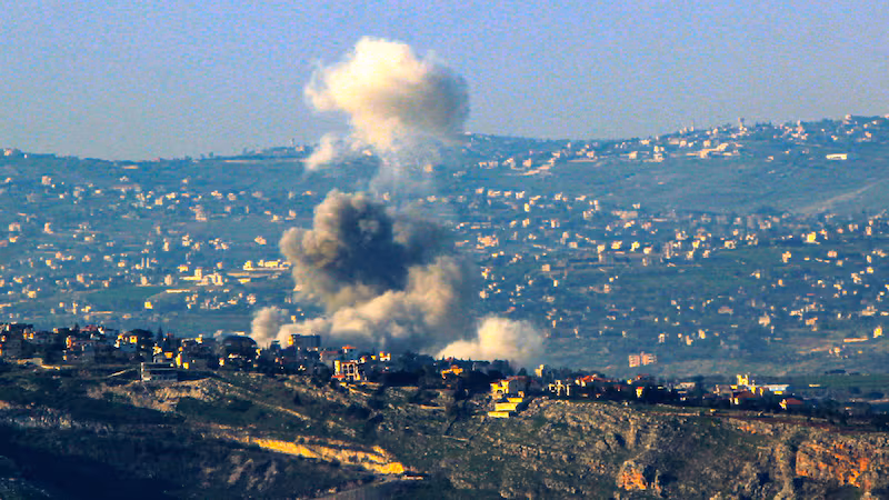 Smoke from an Israeli air raid billows from alleged pro-Iranian Hezbollah positions in the southern Lebanese village of Dier Siran, Lebanon.