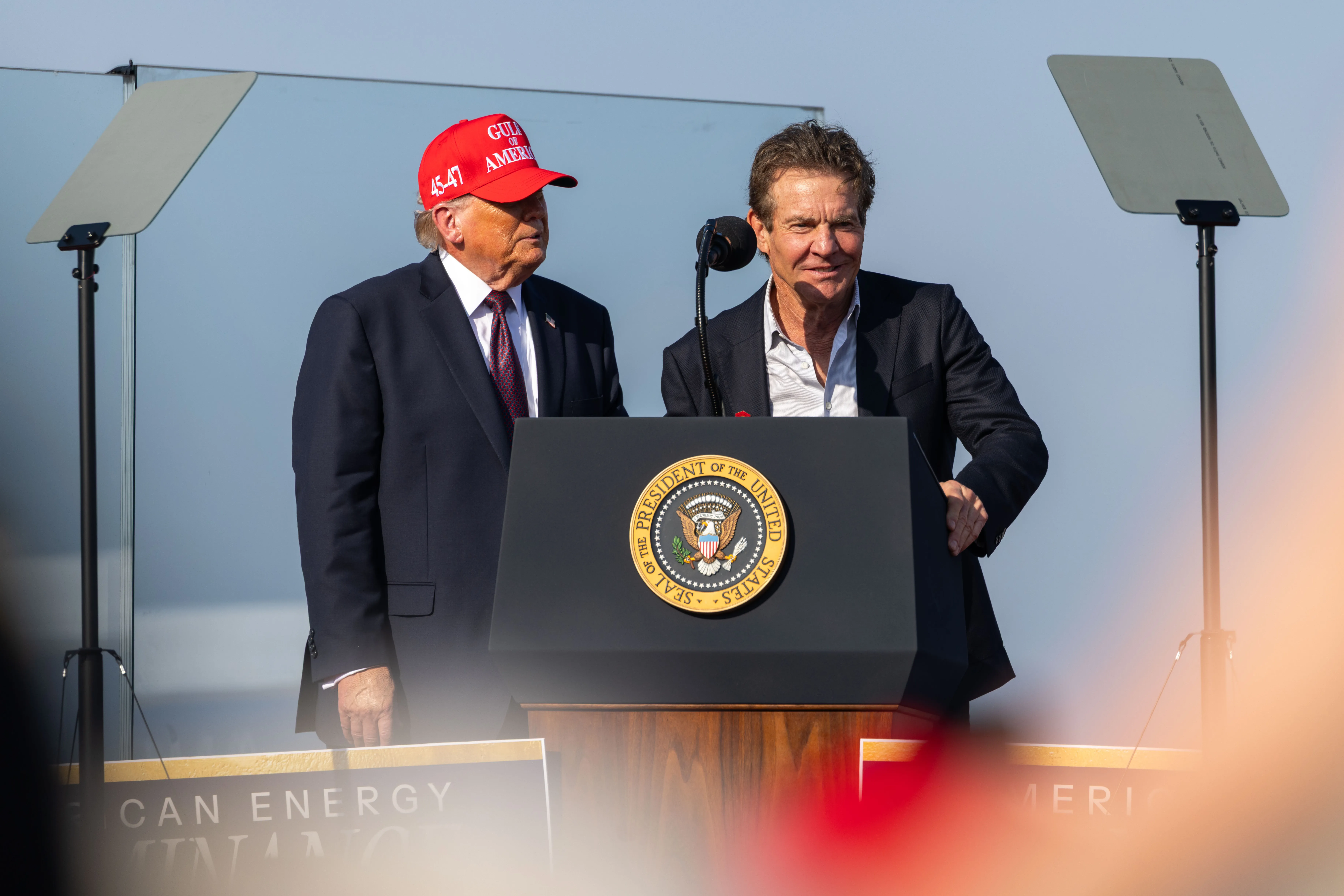 Dennis Quaid appears next to President Donald Trump during an event at the Port of Corpus Christi on Feb. 27, 2026.
