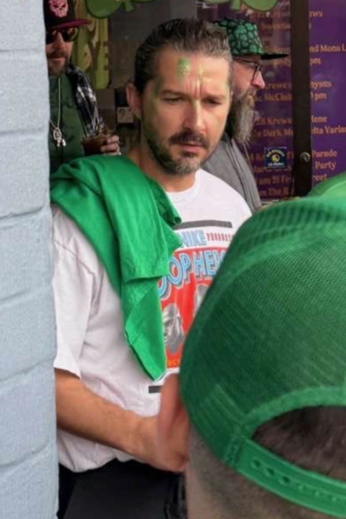 Shia LaBeouf with green face paint celebrating St. Patrick's Day on Bourbon Street.
