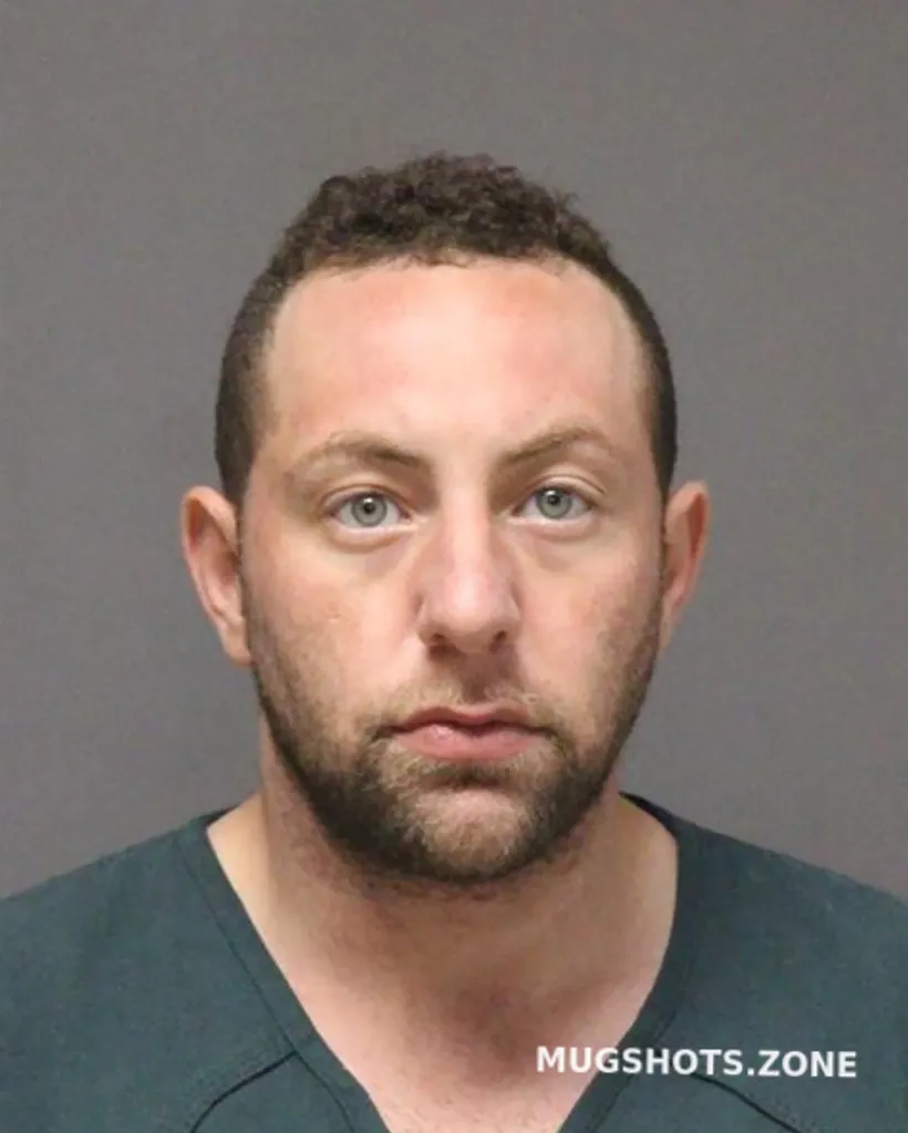 A mugshot of Zalouk. 