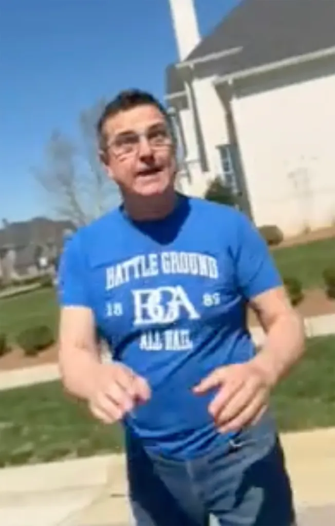 Man in glasses and a blue 