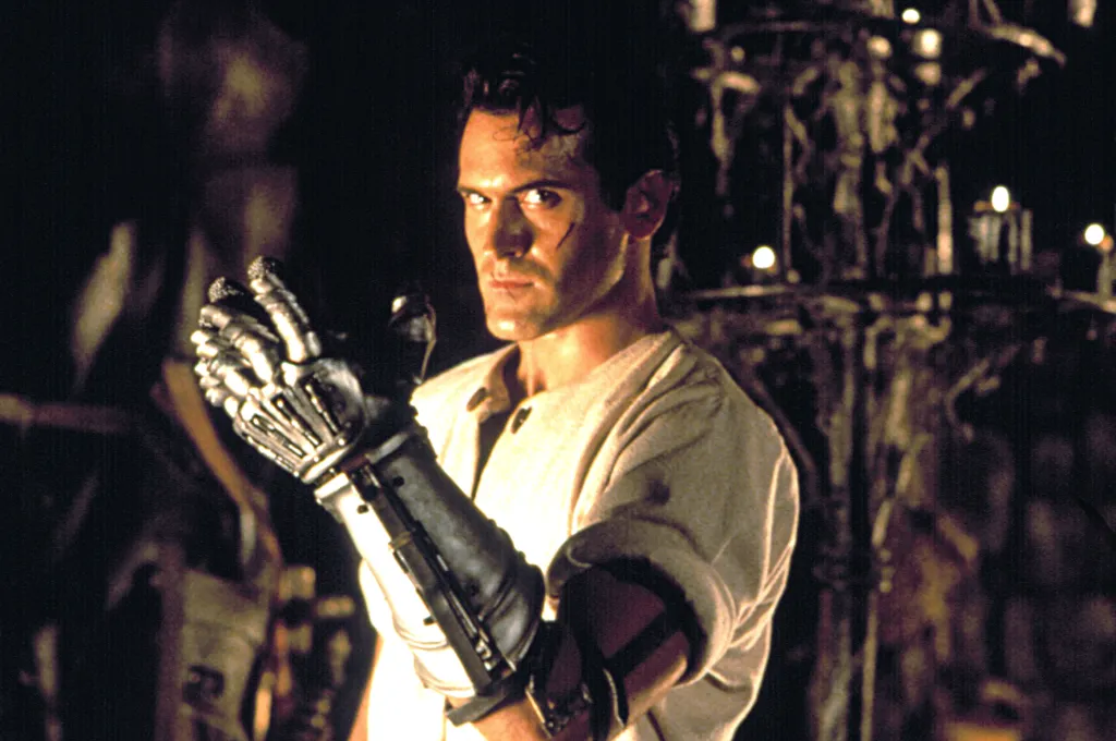 Bruce Campbell with a metal gauntlet in 