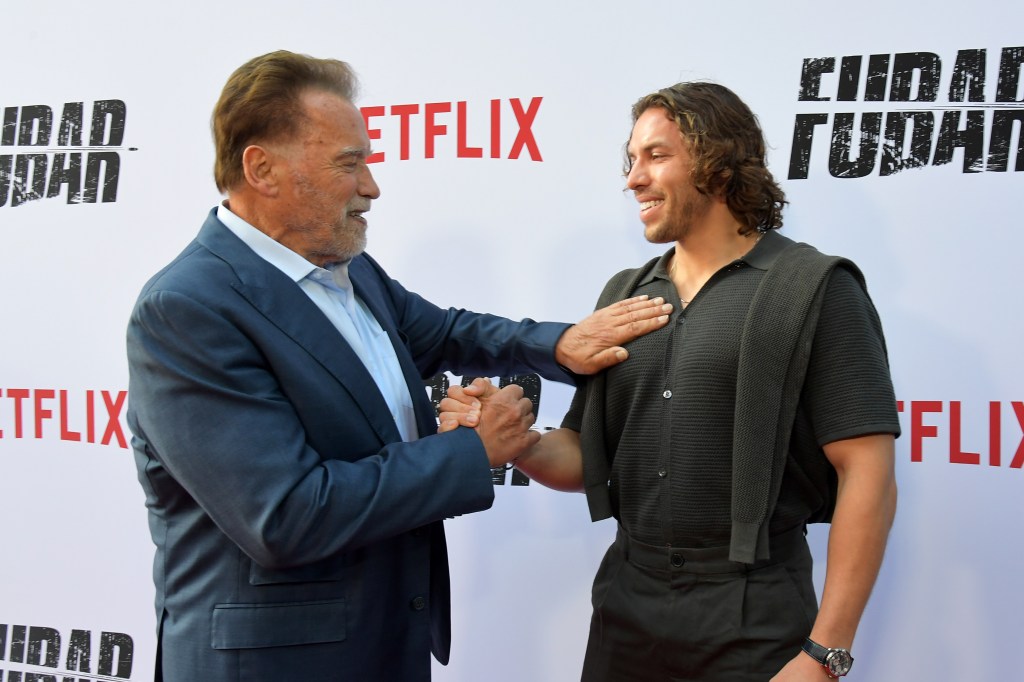 Arnold Schwarzenegger and Joseph Baena handshake at the Netflix 