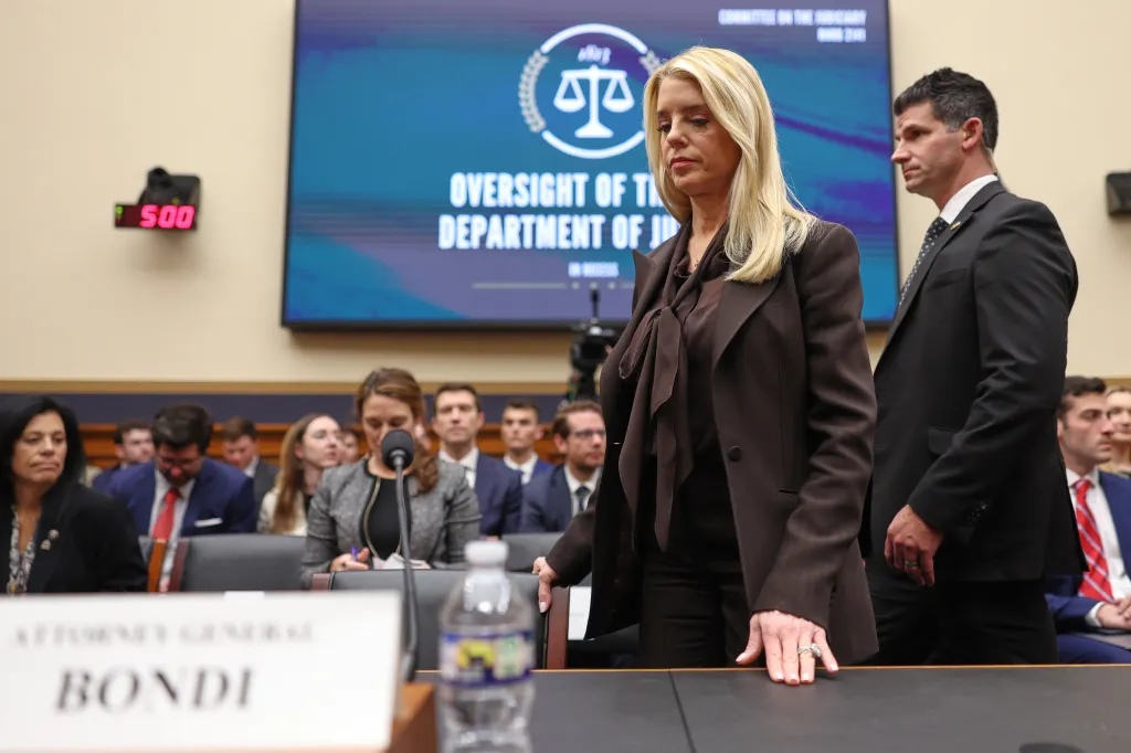 Pam Bondi walking to the witness table during a House Judiciary Committee oversight hearing.