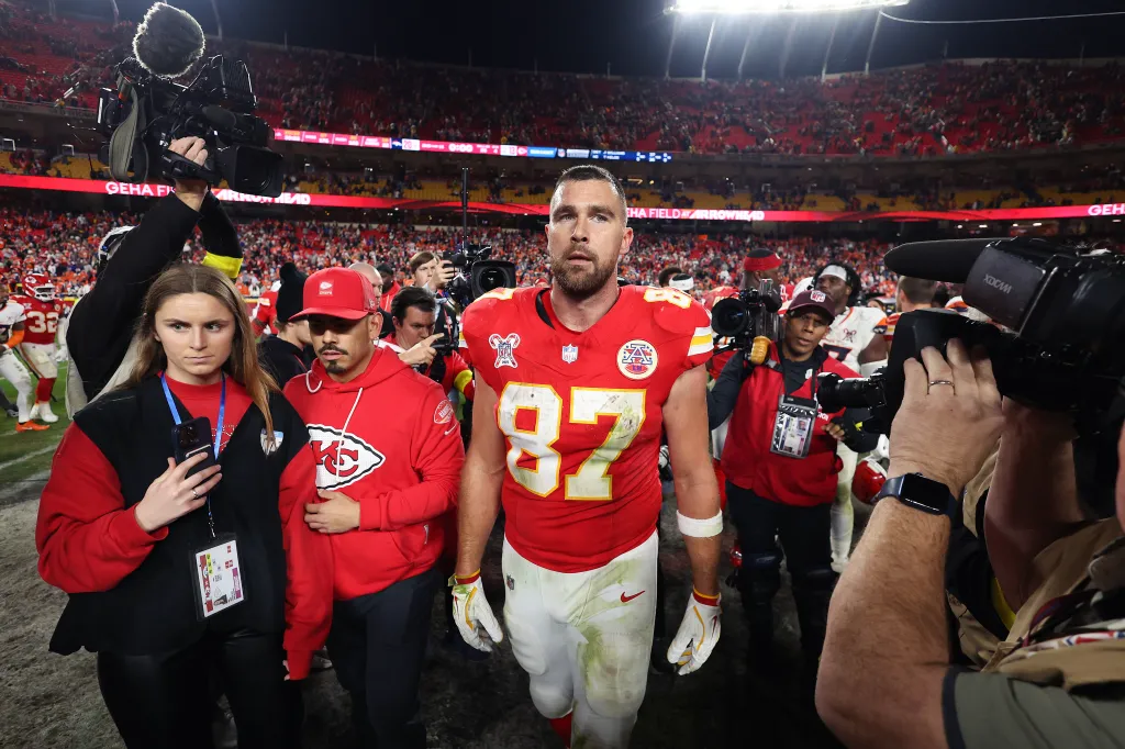 Kansas City Chiefs player Travis Kelce leaves the field after losing to the Denver Broncos.