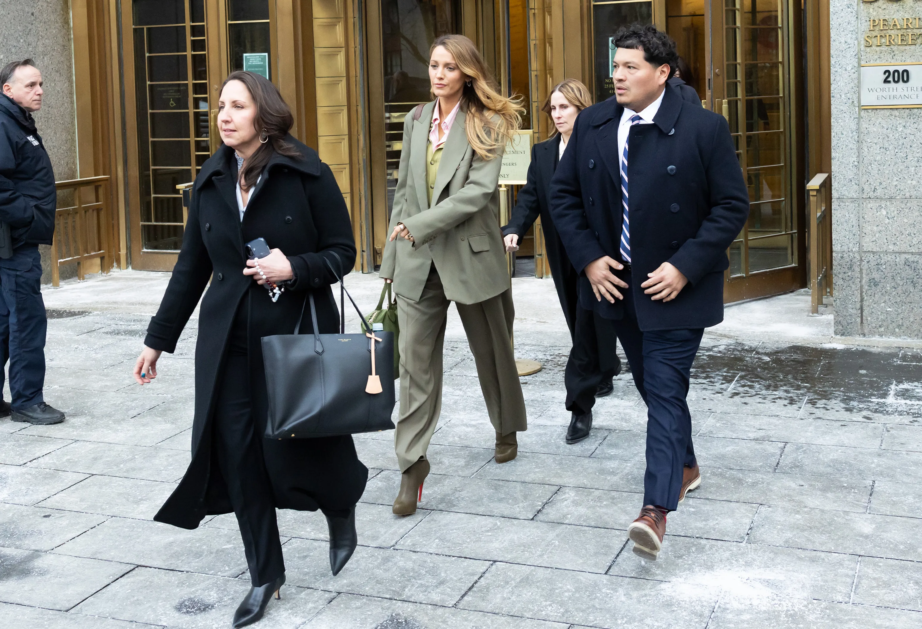 Blake Lively walks out of the New York Federal Courthouse with her team.