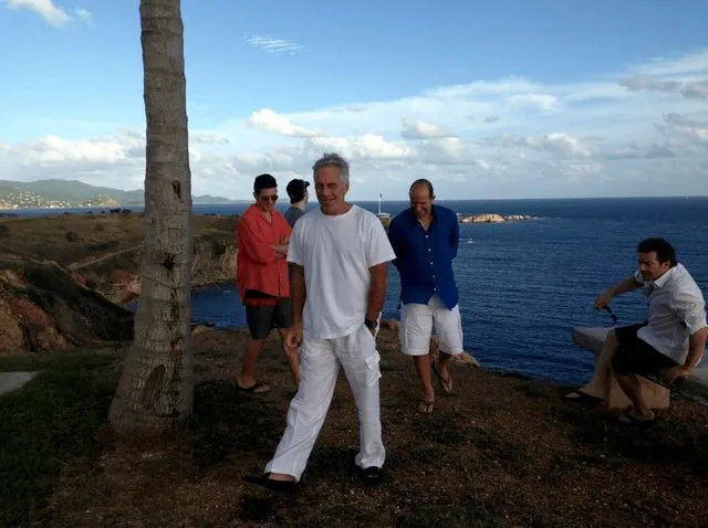 Jeffrey Epstein and Howard Lutnick (in blue shirt) on Epstein's island.