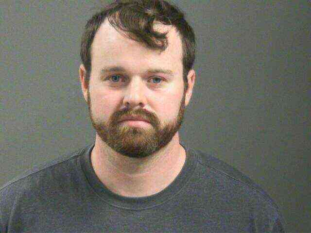 Mugshot of Joseph Duggar with a beard and dark hair.