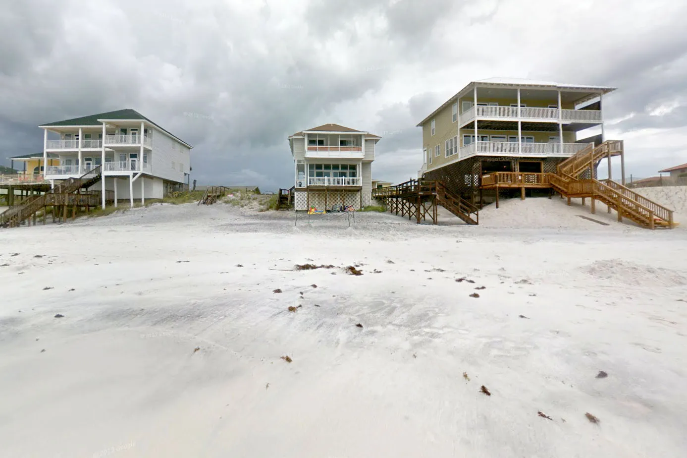 Three beachfront homes, with Brian Littrell's three-bedroom Santa Rosa Beach home in the middle.