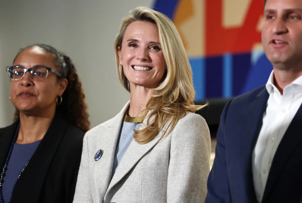 Jennifer Siebel Newsom smiles at an event where her husband, Governor Gavin Newsom, signed legislation improving kids' nutrition.