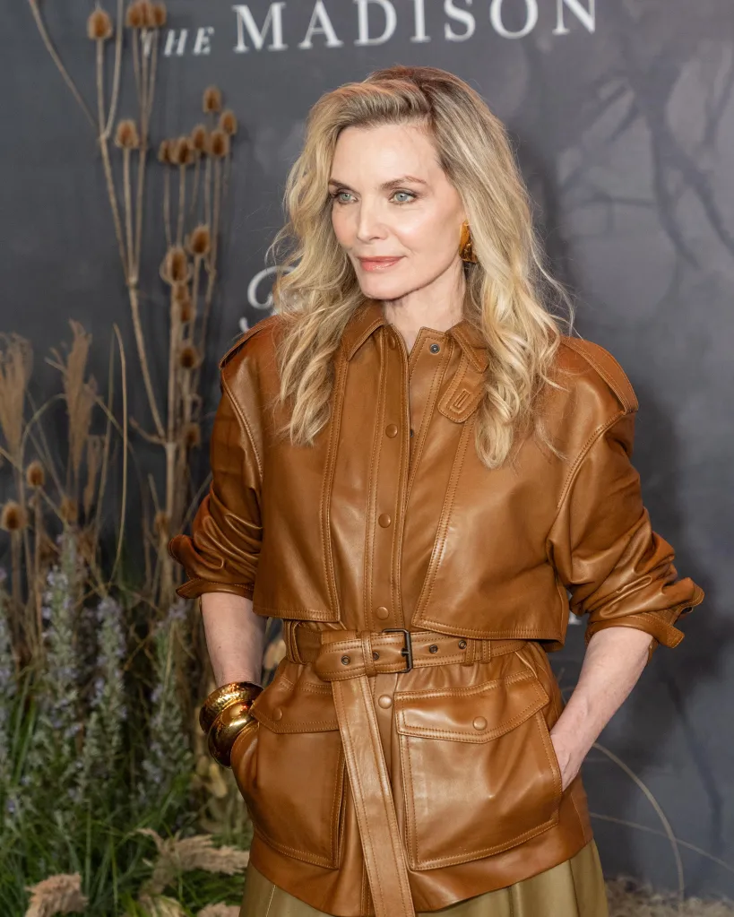 Michelle Pfeiffer in a brown leather jacket and skirt at 