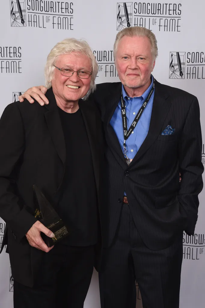 Chip Taylor and Jon Voight posing together with an award at the Songwriters Hall of Fame event.