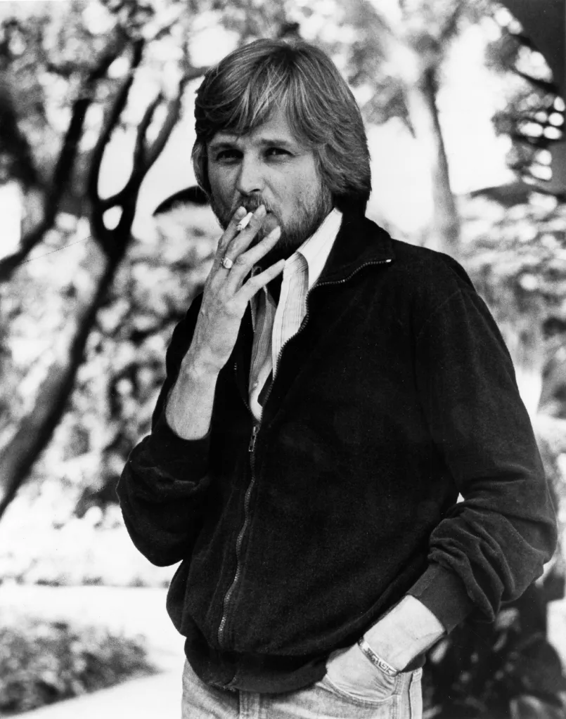 Chip Taylor smoking a cigarette.