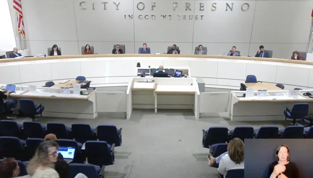 The Fresno City Council, Boards, and Commissions meeting in progress with a sign language interpreter in the bottom right corner.