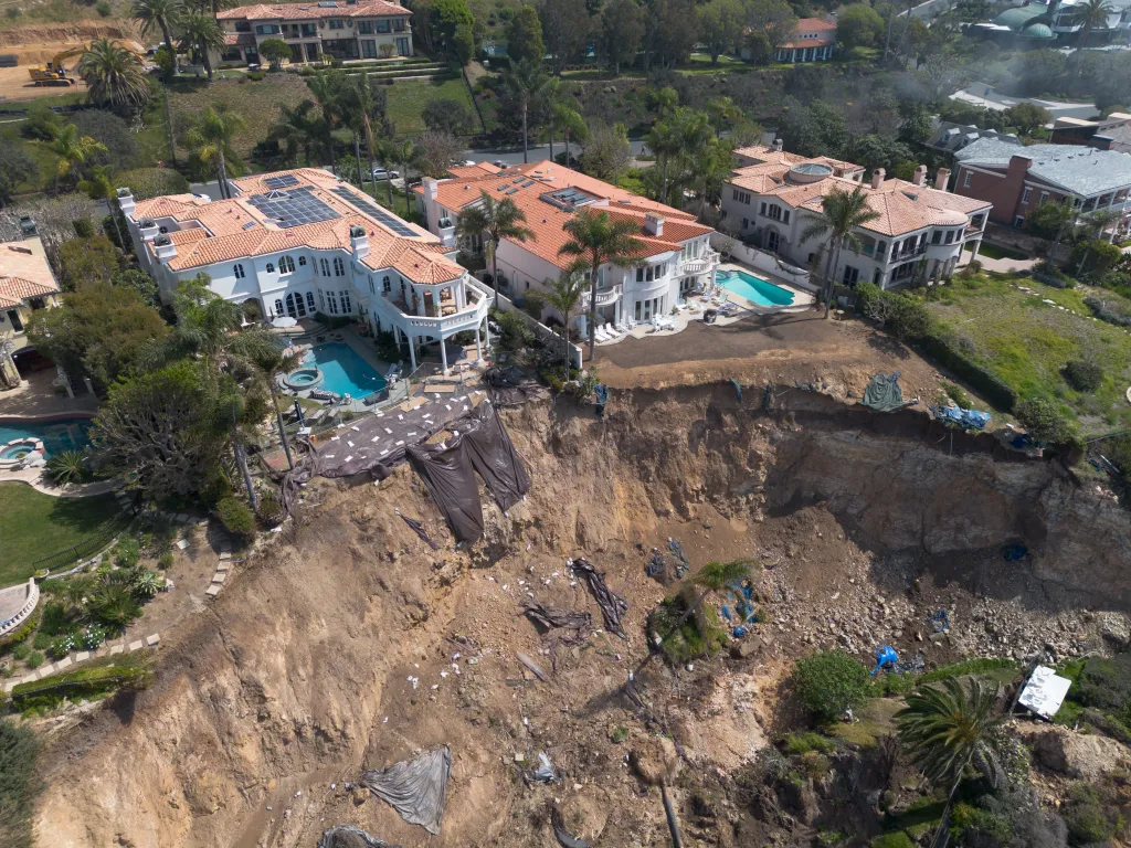 Aerial view of mansions on Marguerite Drive in Palos Verdes near a large landslide.