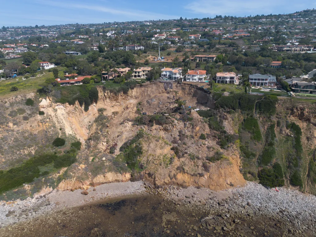 Aerial view of cliff edge mansions on Marguerite Drive in Palos Verdes, California on the verge of collapsing due to landslides.