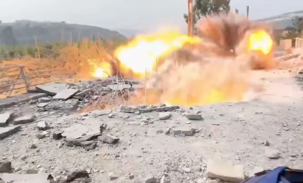 Explosion of a missile strike near a correspondent and cameraman in southern Lebanon.