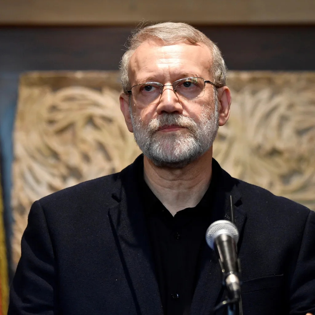 Ali Larijani, senior advisor to Iran's Supreme Leader, speaking at a podium with a microphone.