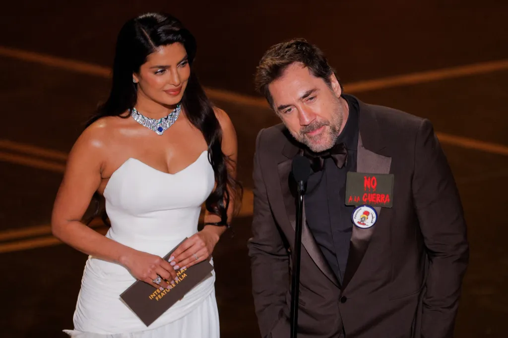 Javier Bardem and Priyanka Chopra Jonas on stage at the Oscars.