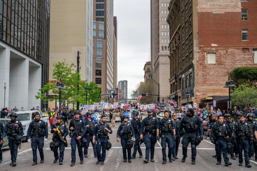 The Dallas Police Department work to contain a demonstration during a 