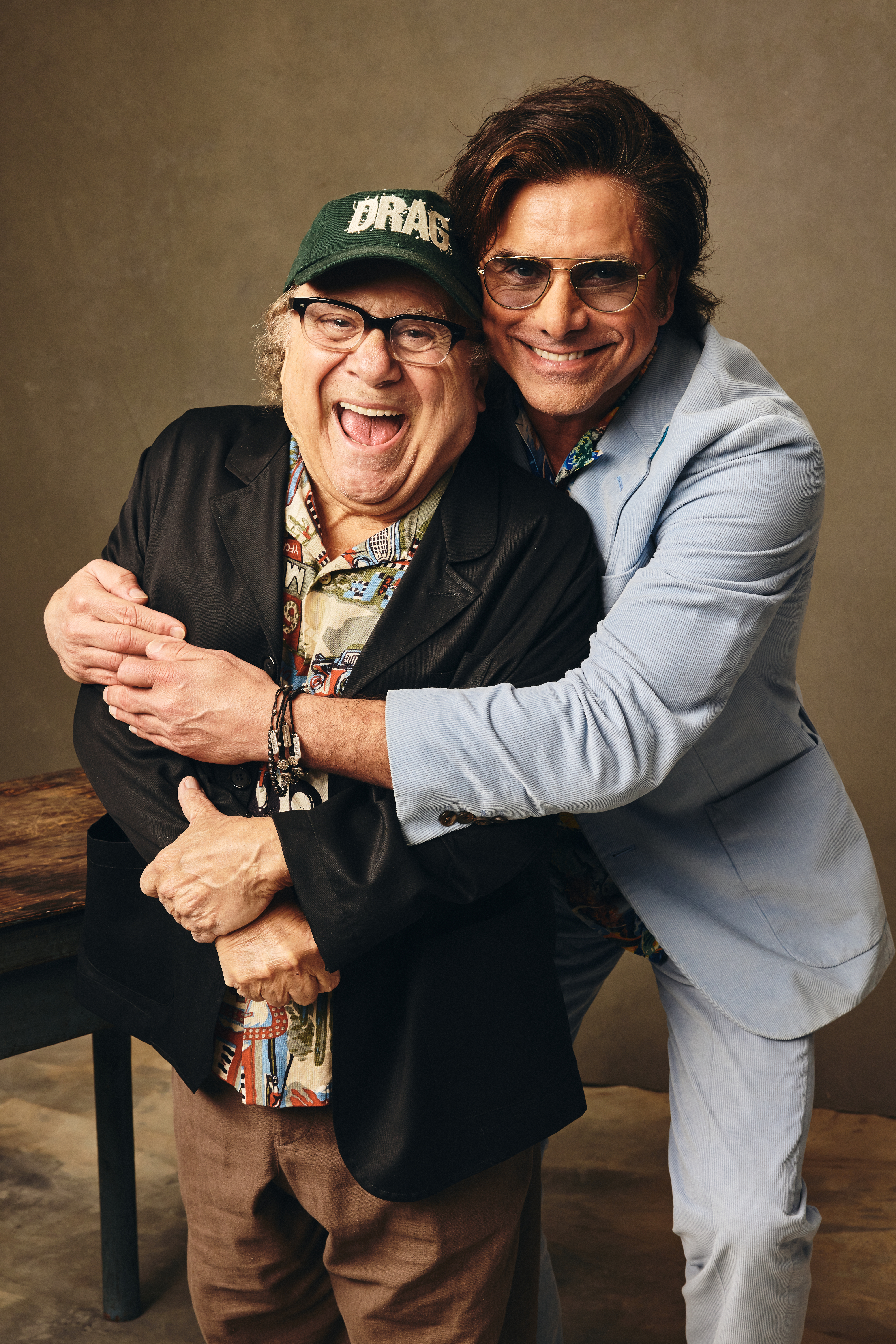 John Stamos hugs Danny DeVito at SxSW in Austin, Texas, on March 13, 2026.