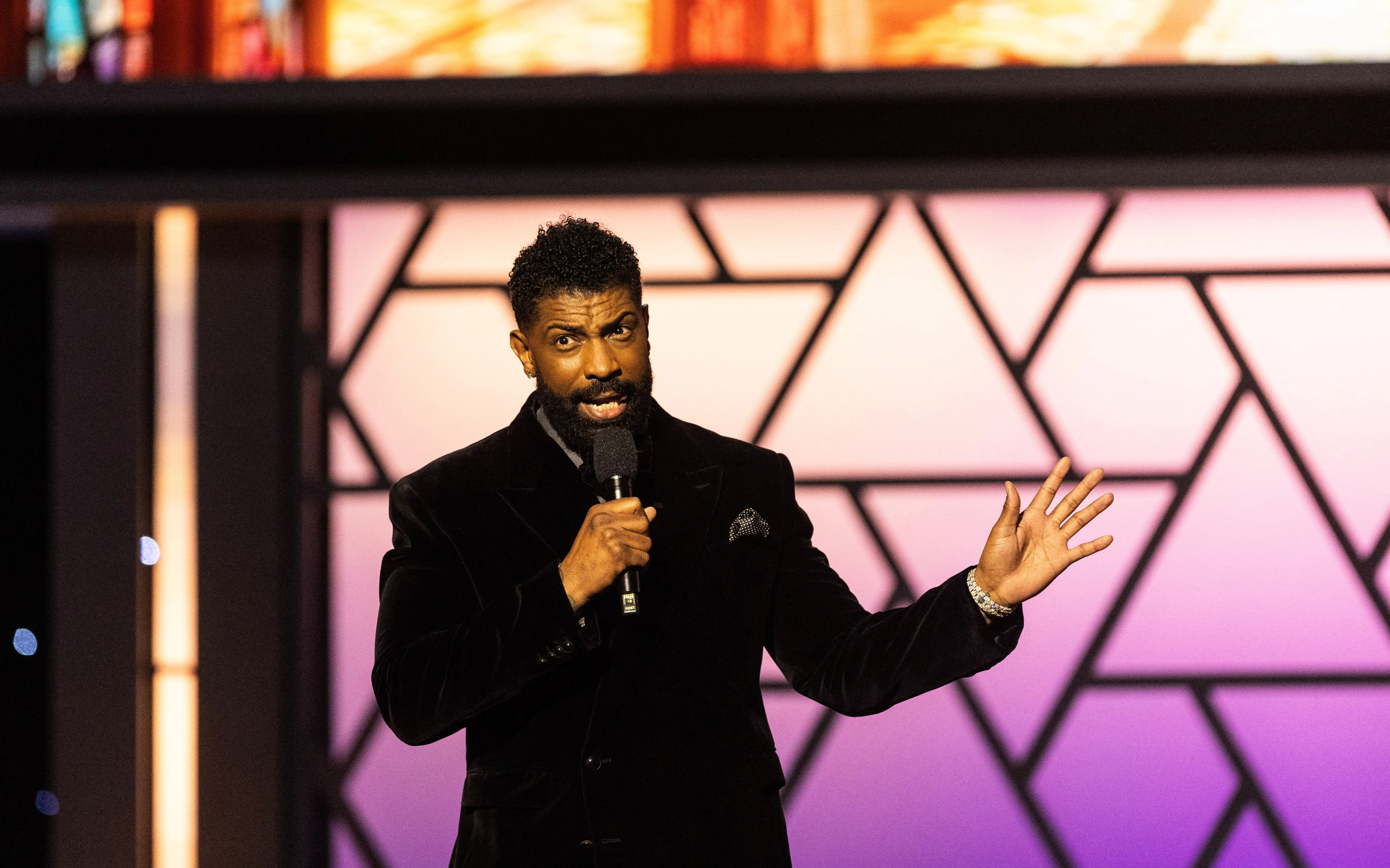 Deon Cole speaking onstage at the NAACP Image Awards.