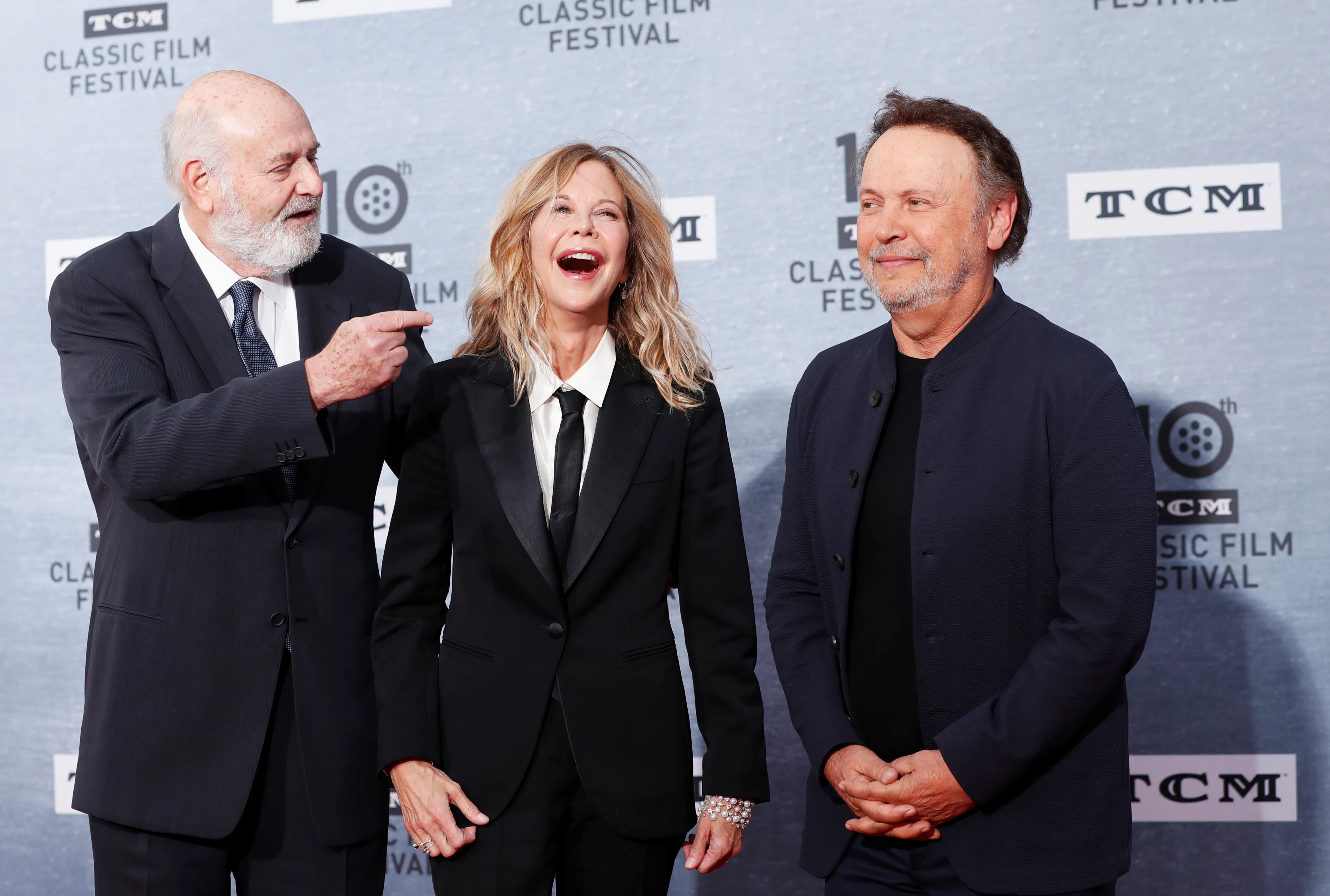 Director of the movie Rob Reiner with cast members Billy Crystal and Meg Ryan react as they arrive for the 30th anniversary screening of comedy movie 