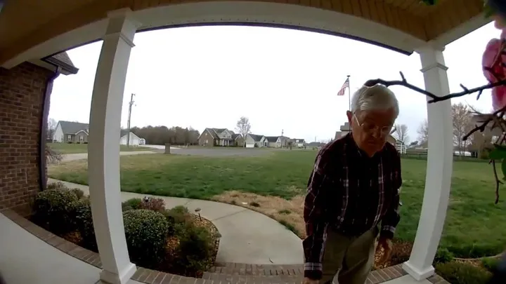 Richard Pulley drops off a DoorDash delivery in Manchester, Tenn., on March 10, 2026.