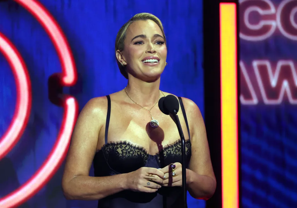 Teddi Mellencamp Arroyave speaks onstage at the 2026 iHeartRadio Music Awards.