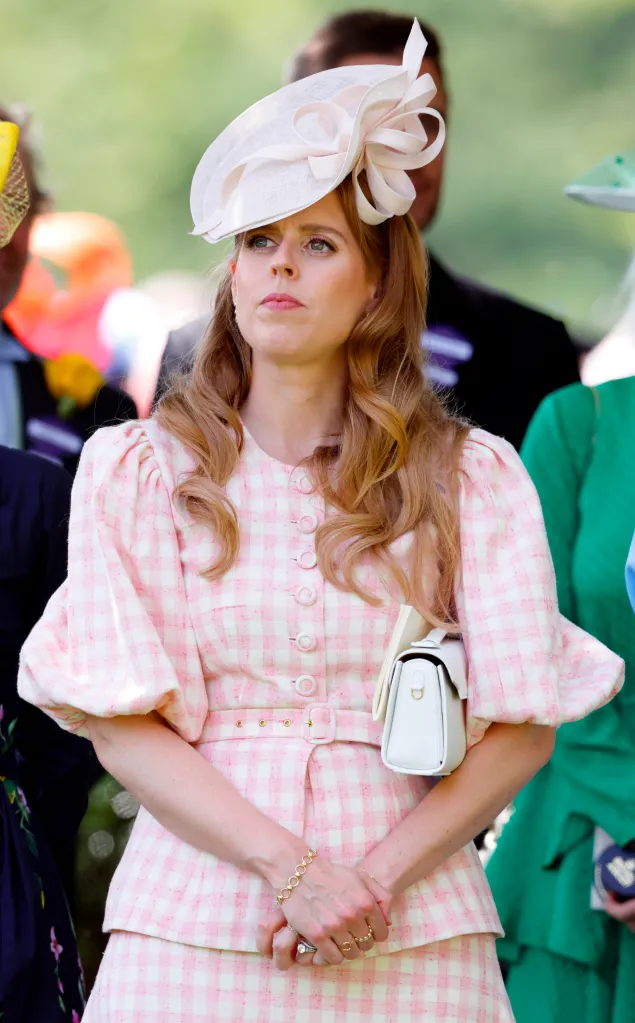 Princess Beatrice at Royal Ascot, wearing a pink and white checkered dress, a white hat, and holding a white handbag.