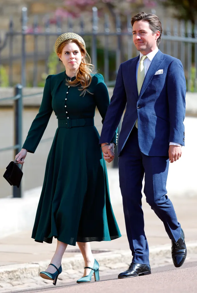 Princess Beatrice and Edoardo Mapelli Mozzi walk holding hands.