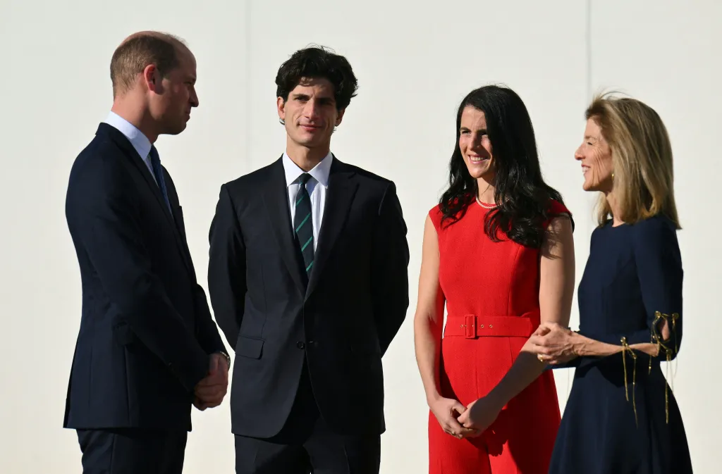 Prince William, Jack Kennedy Schlossberg, Tatiana Kennedy Schlossberg, and Caroline Kennedy standing together.