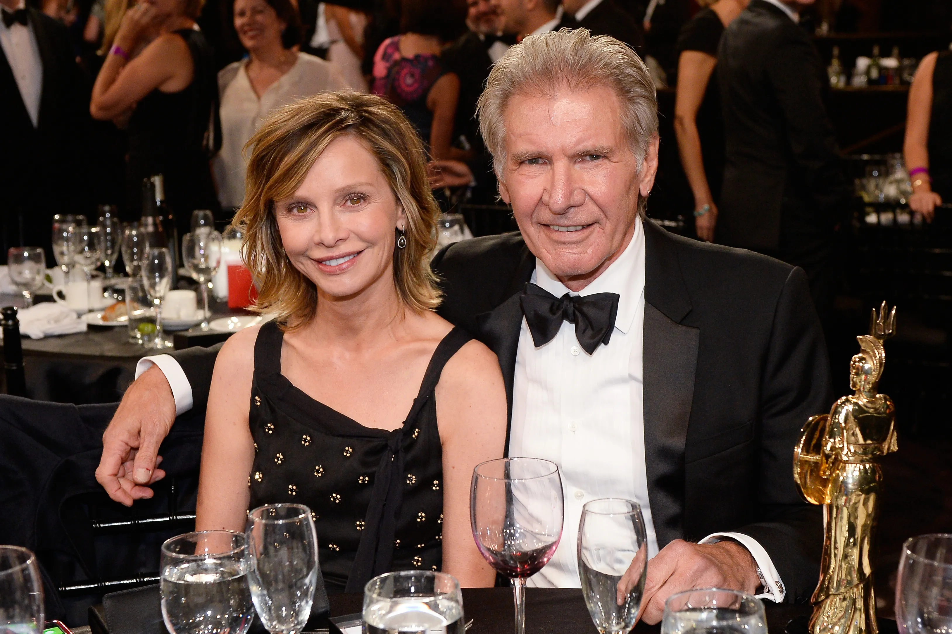 Harrison Ford and Calista Flockhart pose at an awards' presentation in 2015