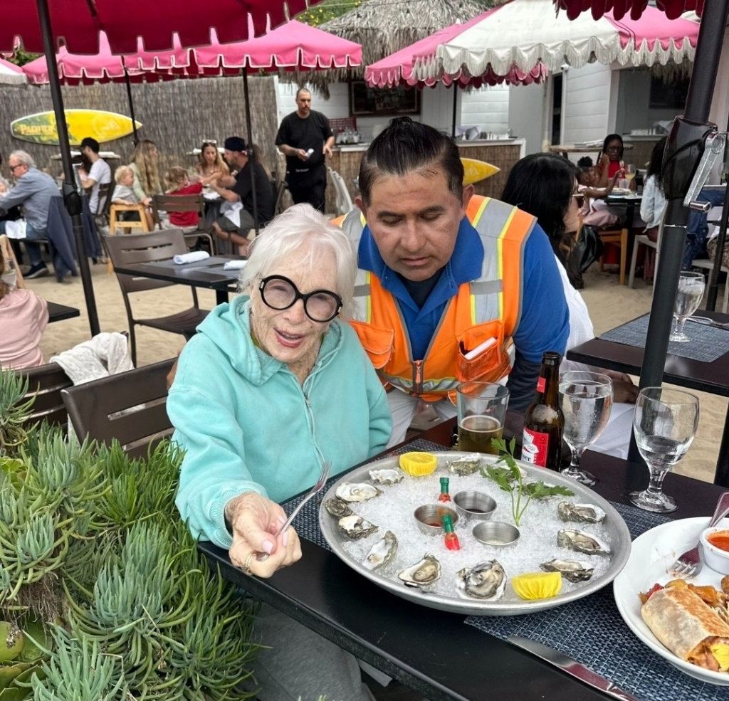 Shirley MacLaine enjoying oysters for lunch in Malibu.