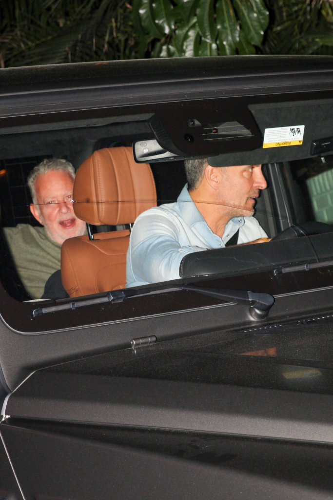 Mauricio Umansky driving a car with PK Kemsley in the passenger seat.
