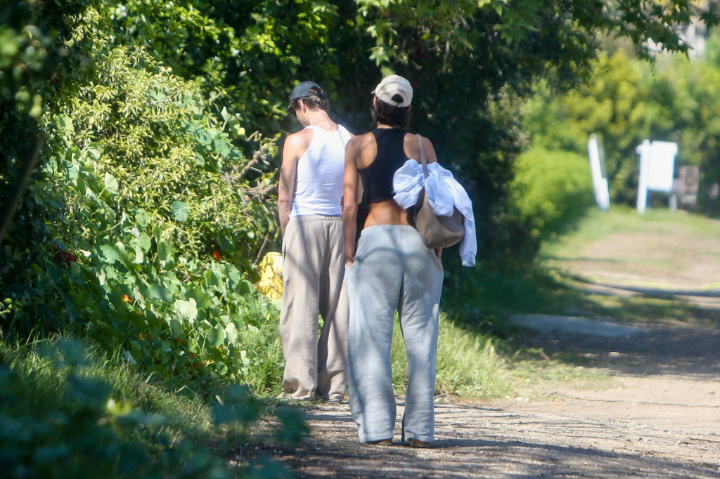 Shawn Mendes urinating by the side of the road with Bruna Marquezine standing nearby.