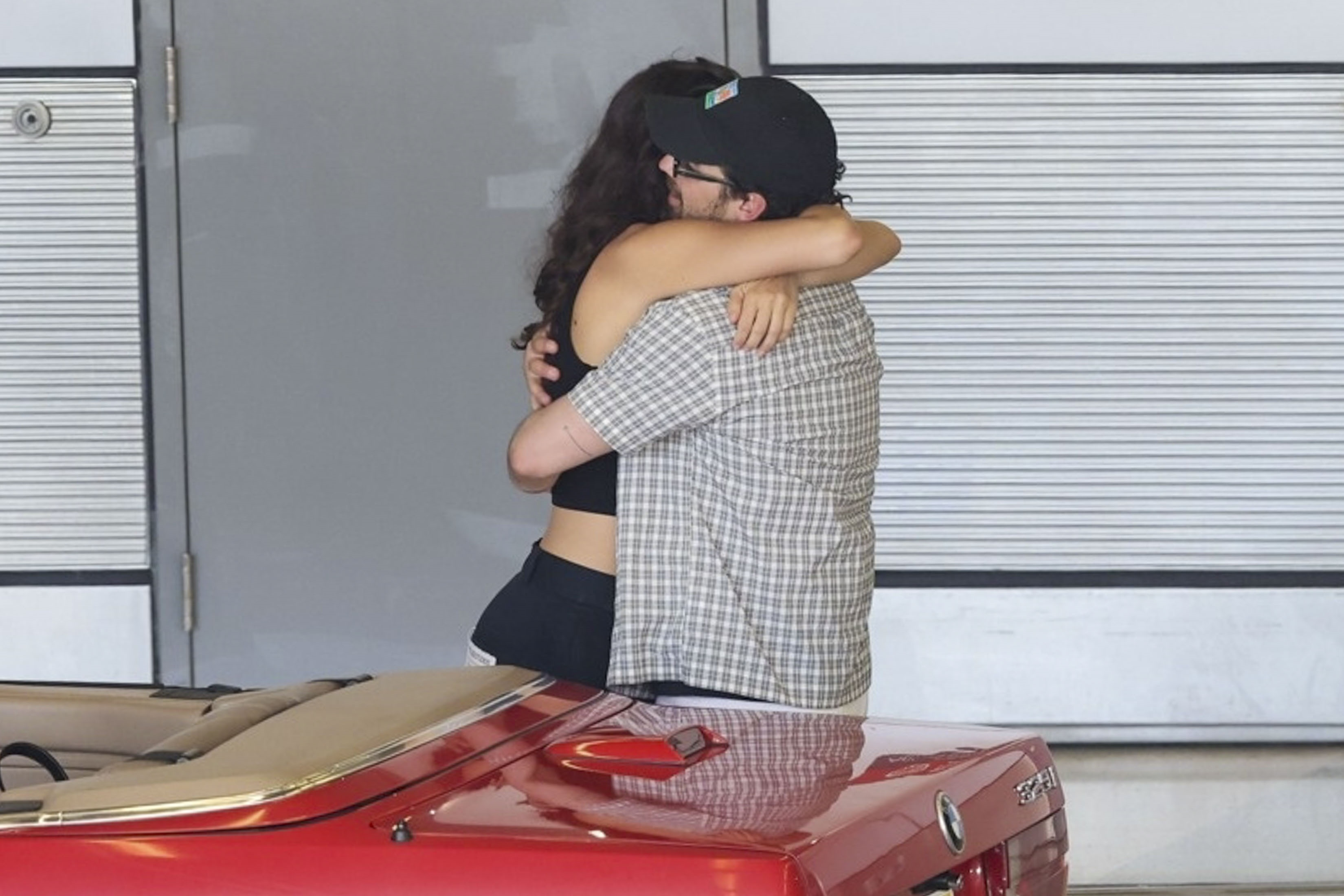 Joe Jonas and Tatiana Gabriela embracing.