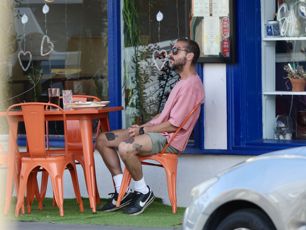 Shia LaBeouf sits at an outdoor table in New Orleans after his recent arrest.