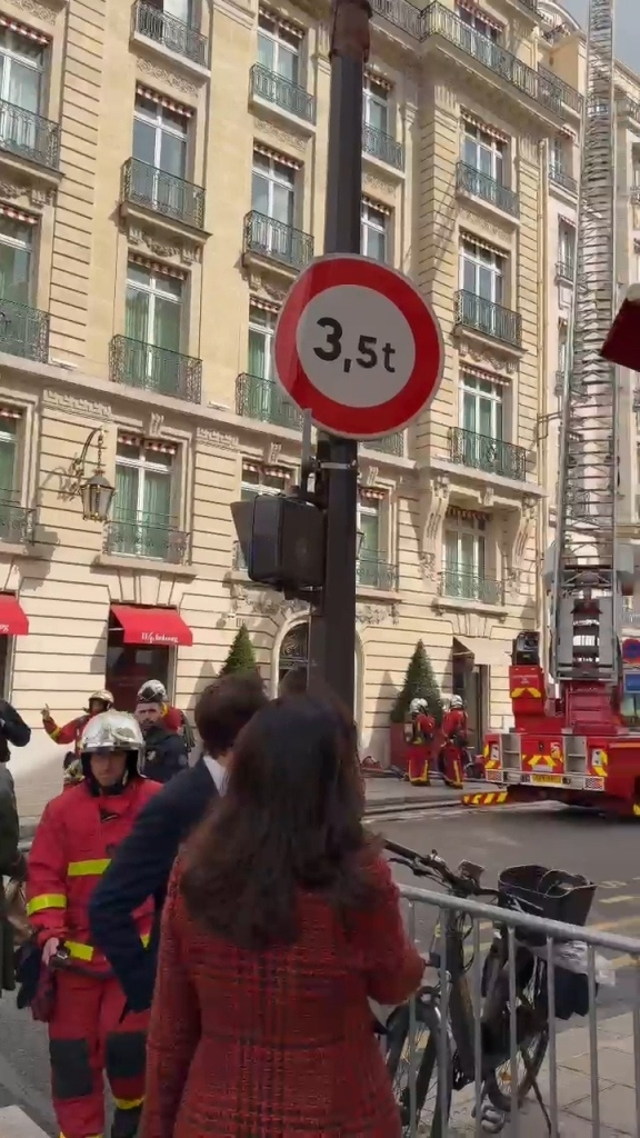 Firefighters at a hotel housing Sarah Michelle Gellar, Kathryn Newton, and Elijah Wood during an evacuation.