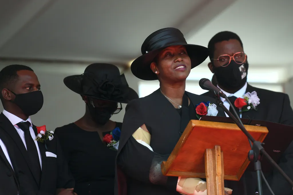 Former first lady of Haiti, Martine Moise, speaks, accompanied by her children, at the funeral of her slain husband, former President Jovenel Moise, on July 23, 2021, in Cap-Haitien, Haiti.