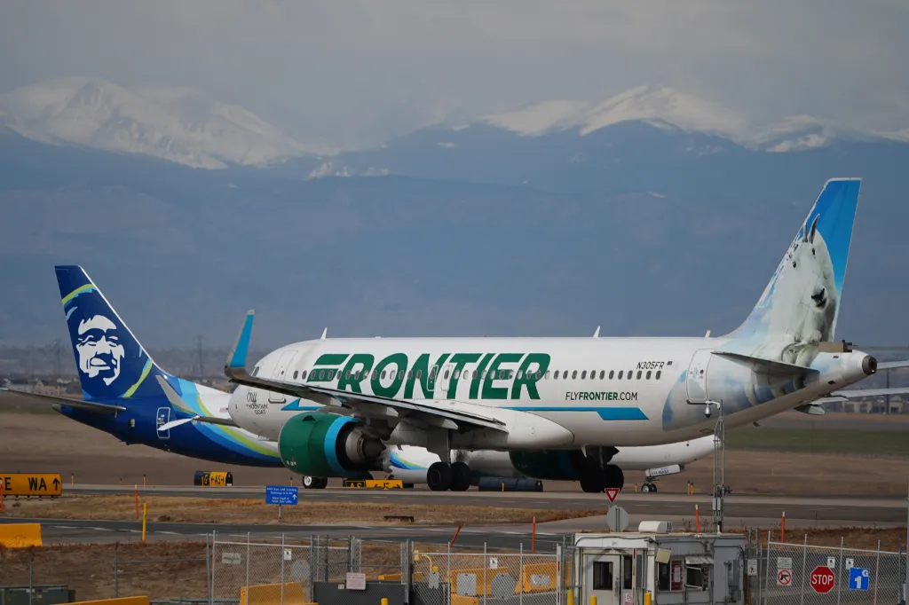 Frontier Airlines jetliner waits for clearance to take off from Denver International Airport.